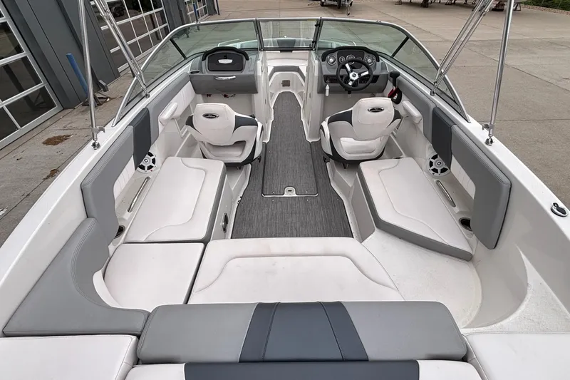 Slide: The Image of Interior view of 2021 Chaparral 23 SSi boat, featuring spacious seating and modern design. - 11
