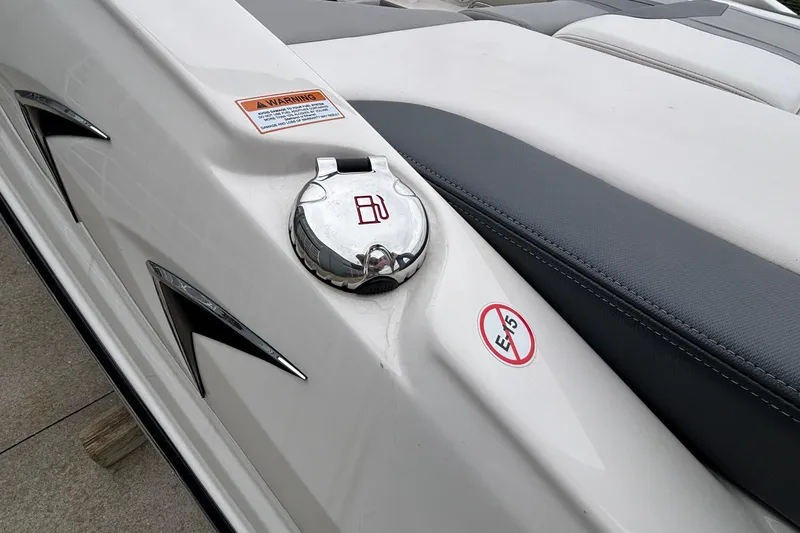 Slide: The Image of 2021 Chaparral 23 SSi boat fuel cap with E5 warning label. - 12