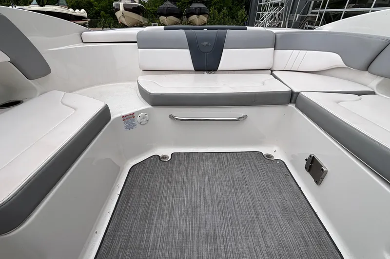 Slide: The Image of Interior seating of 2021 Chaparral 23 SSi boat with gray and white upholstery. - 16