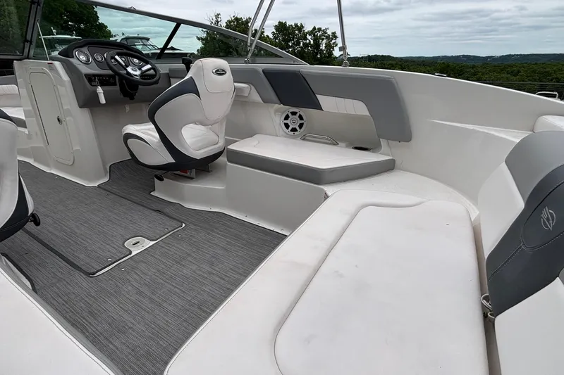 Slide: The Image of 2021 Chaparral 23 SSi boat interior with modern seating and steering wheel. - 19