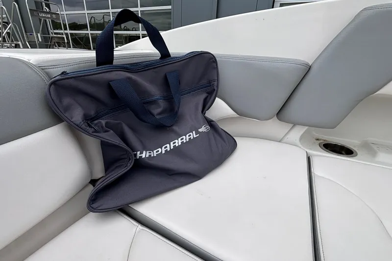 Slide: The Image of Chaparral 23 SSi 2021 boat interior with branded bag on seat. - 22