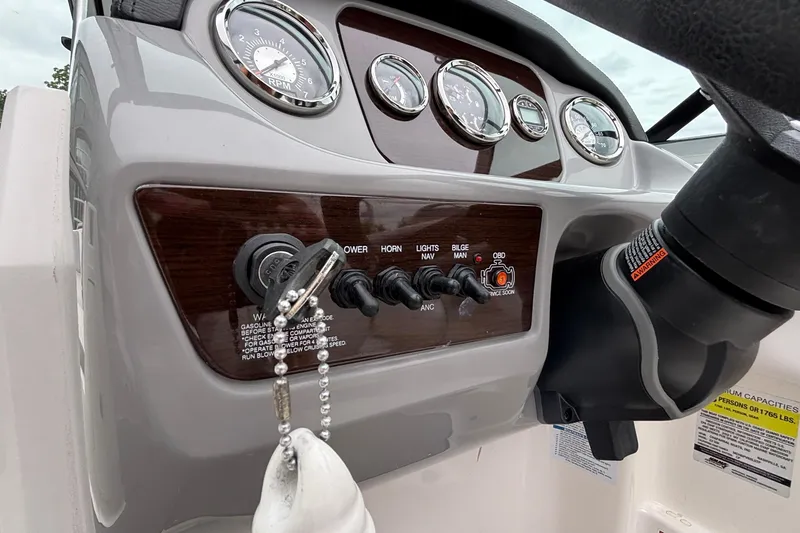 Slide: The Image of Dashboard of a 2021 Chaparral 23 SSi boat with gauges and controls. - 28