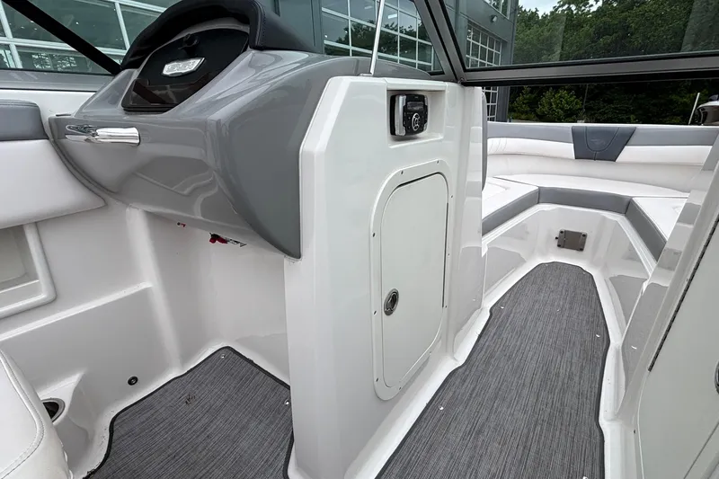 Slide: The Image of 2021 Chaparral 23 SSi boat interior with sleek design and modern dashboard. - 31