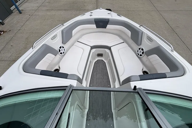 Slide: The Image of 2021 Chaparral 23 SSi boat interior with gray and white seating. - 37