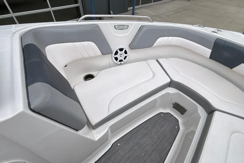 Slide: The Image of Interior view of 2021 Chaparral 23 SSi boat, featuring gray and white seating. - 38
