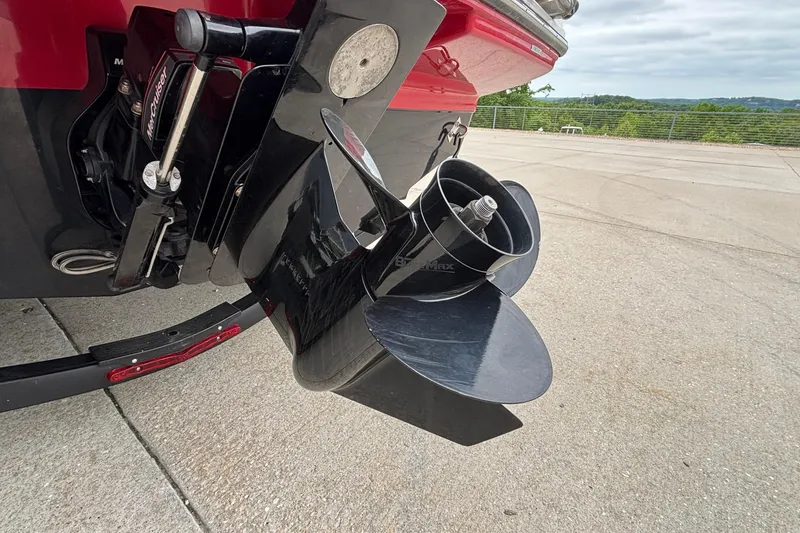 Slide: The Image of 2021 Chaparral 23 SSi boat propeller and outdrive on concrete surface. - 48