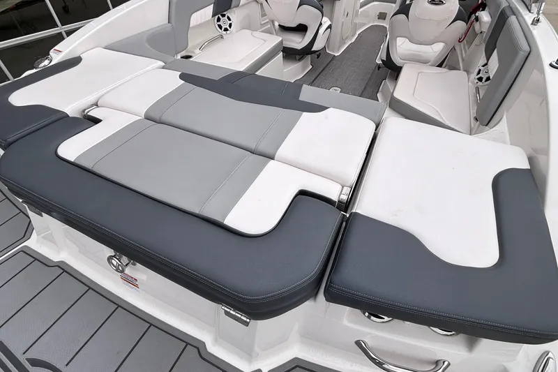 Slide: The Image of 2021 Chaparral 23 SSi boat interior with gray and white seating arrangement. - 8
