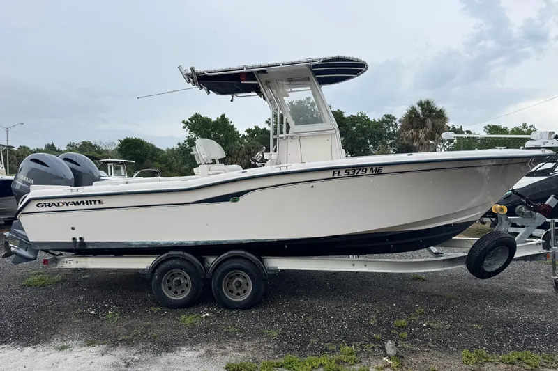 The Image of 2003 Grady-White Advance 257 boat on trailer, side view with twin Yamaha engines. - 0