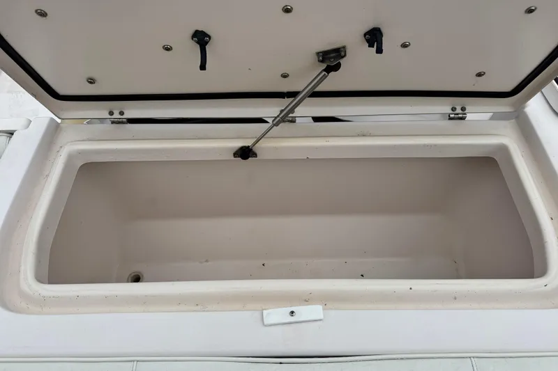 Slide: The Image of Open storage compartment on a 2003 Grady-White Advance 257 boat. - 10