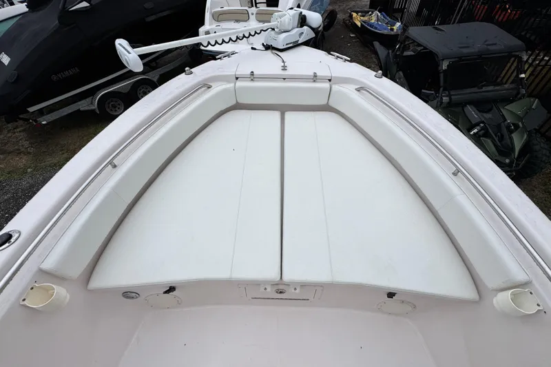 Slide: The Image of 2003 Grady-White Advance 257 boat interior with cushioned seating and storage compartments. - 17