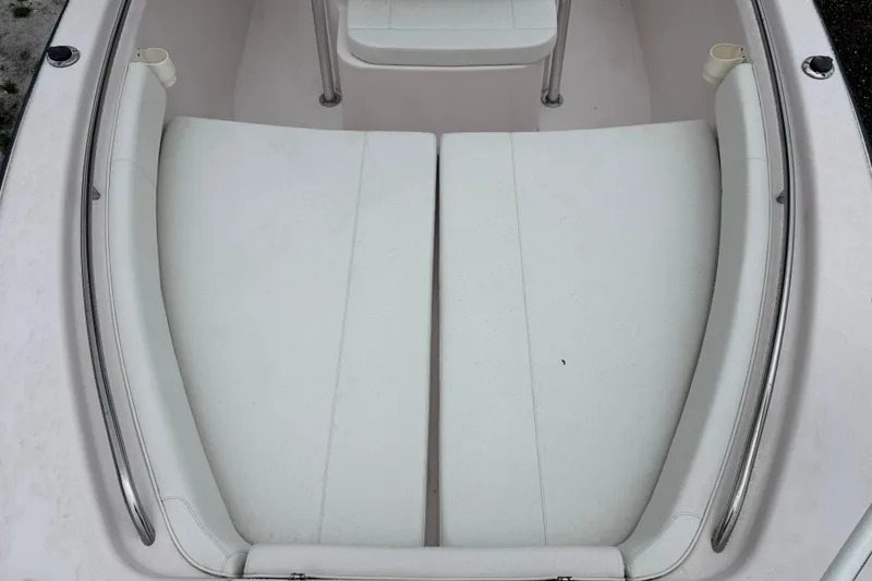 Slide: The Image of 2003 Grady-White Advance 257 boat interior with white cushioned seating. - 20