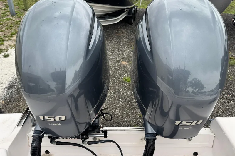 Slide: The Image of Twin Yamaha 150 outboard engines on a 2003 Grady-White Advance 257 boat. - 26