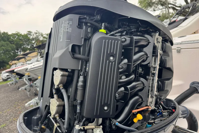 Slide: The Image of Close-up of a 2003 Grady-White Advance 257 boat engine, showcasing intricate mechanical details. - 28