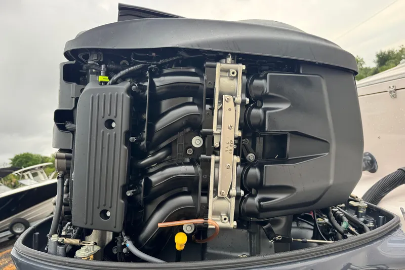 Slide: The Image of Close-up of a 2003 Grady-White Advance 257 boat engine, showcasing intricate mechanical details. - 29
