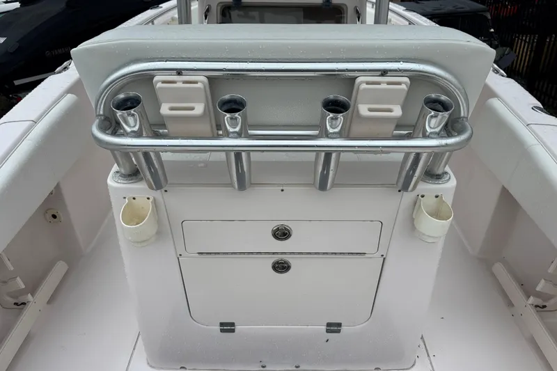 Slide: The Image of 2003 Grady-White Advance 257 boat console with rod holders and storage compartments. - 5