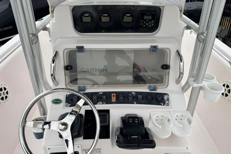 Slide: The Image of 2003 Grady-White Advance 257 boat console with Garmin display and Yamaha controls. - 6