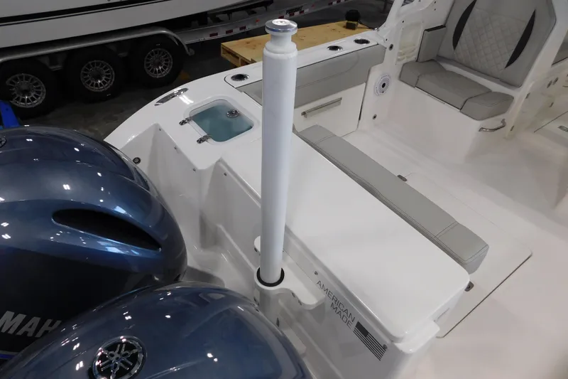 Slide: The Image of 2022 Pursuit DC 266 Dual Console boat interior with Yamaha engines and seating area. - 11