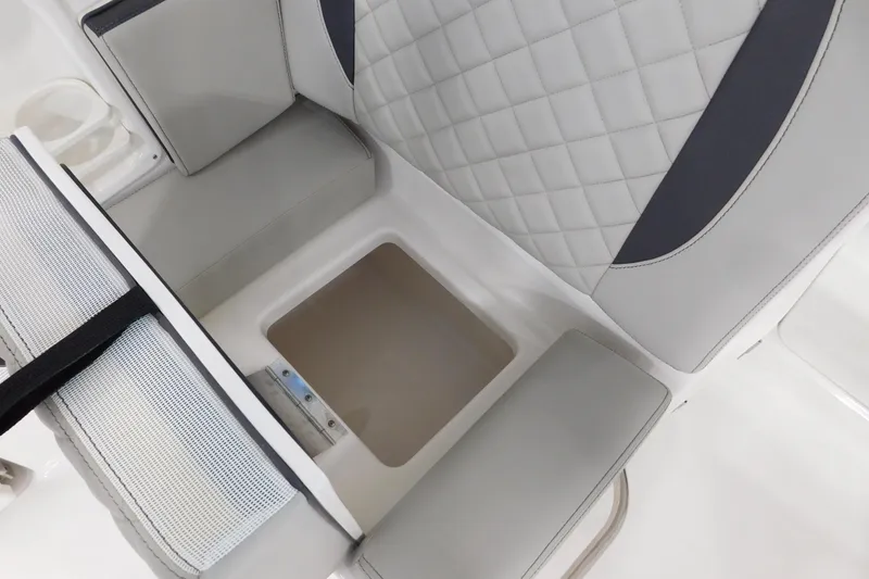 Slide: The Image of 2022 Pursuit DC 266 Dual Console seat with storage compartment, featuring quilted upholstery. - 14