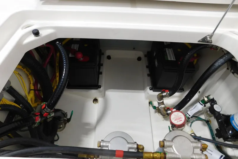 Slide: The Image of Engine compartment of 2022 Pursuit DC 266 Dual Console with batteries and wiring. - 20