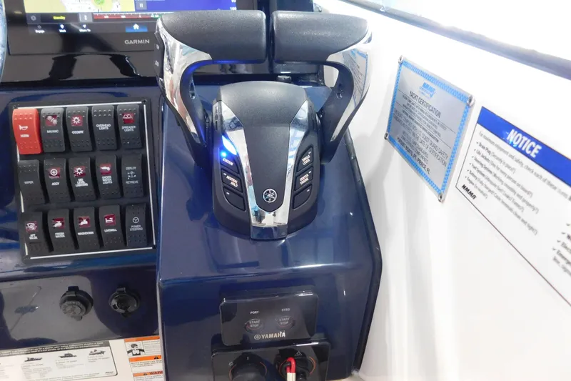 Slide: The Image of 2022 Pursuit DC 266 Dual Console boat controls with Yamaha throttle and Garmin display. - 33