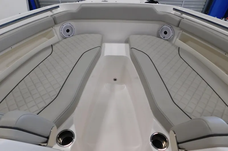 Slide: The Image of Luxurious interior of 2022 Pursuit DC 266 Dual Console boat with cushioned seating. - 45