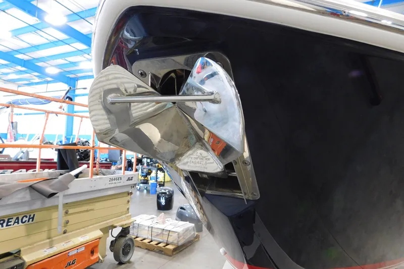 Slide: The Image of 2022 Pursuit DC 266 Dual Console boat in a workshop, showcasing a polished anchor detail. - 5