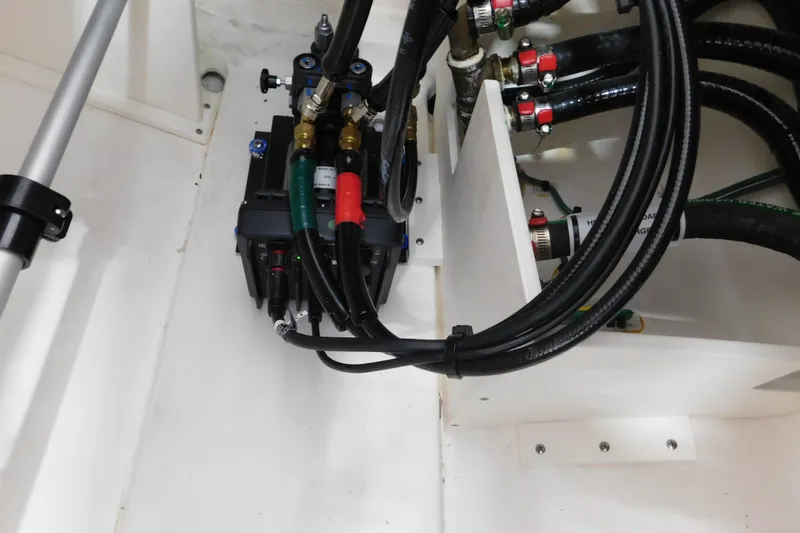 Slide: The Image of 2022 Pursuit DC 266 Dual Console boat wiring and hydraulic system close-up. - 52