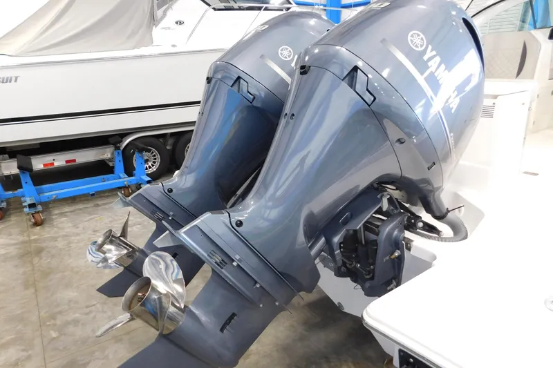 Slide: The Image of Twin Yamaha outboard engines on a 2022 Pursuit DC 266 Dual Console boat. - 7