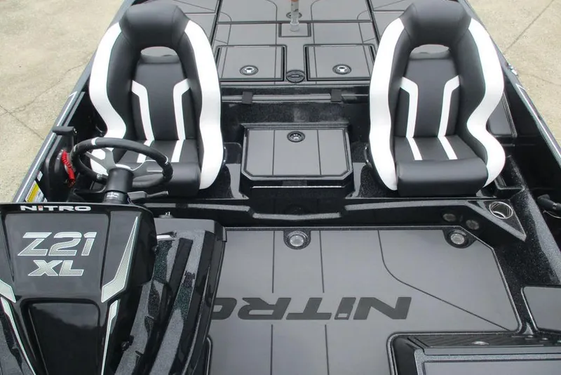 Slide: The Image of 2026 Tracker Pro Guide V-16 WT boat interior with dual seats and steering console. - 10