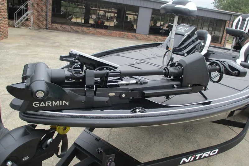 Slide: The Image of 2026 Tracker Pro Guide V-16 WT boat with Garmin trolling motor on trailer. - 11