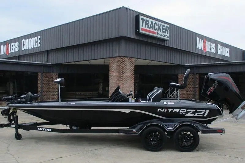 Slide: The Image of 2026 Tracker Pro Guide V-16 WT boat displayed outside Anglers Choice dealership. - 7