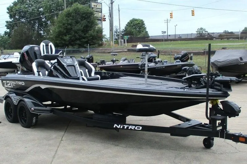 Slide: The Image of 2026 Tracker Pro Guide V-16 WT boat on trailer in outdoor setting. - 9
