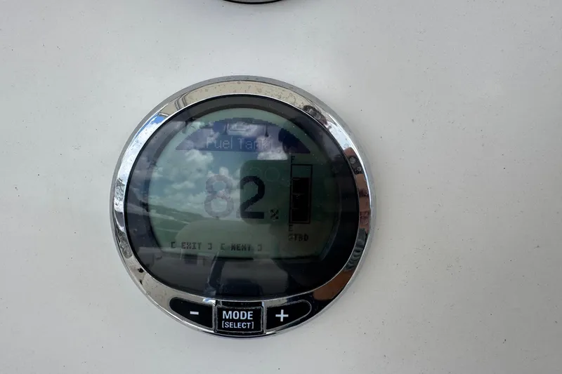 Slide: The Image of Fuel gauge displaying 82% on 2023 Sailfish 242 CC boat dashboard. - 16