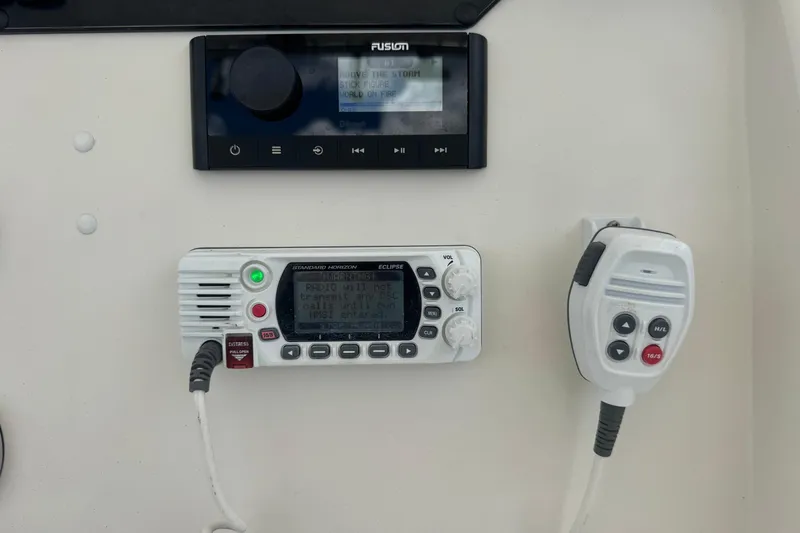 Slide: The Image of Boat communication and audio equipment on a 2023 Sailfish 242 CC console. - 17