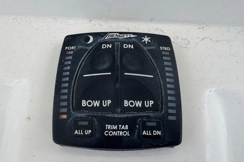 Slide: The Image of Bennett trim tab control panel on 2023 Sailfish 242 CC boat. - 18