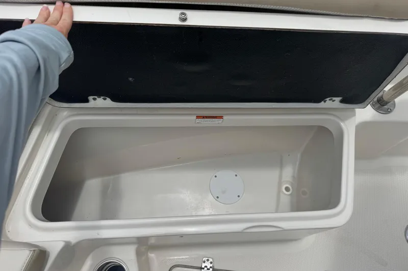 Slide: The Image of Open storage compartment on 2023 Sailfish 242 CC boat. - 23