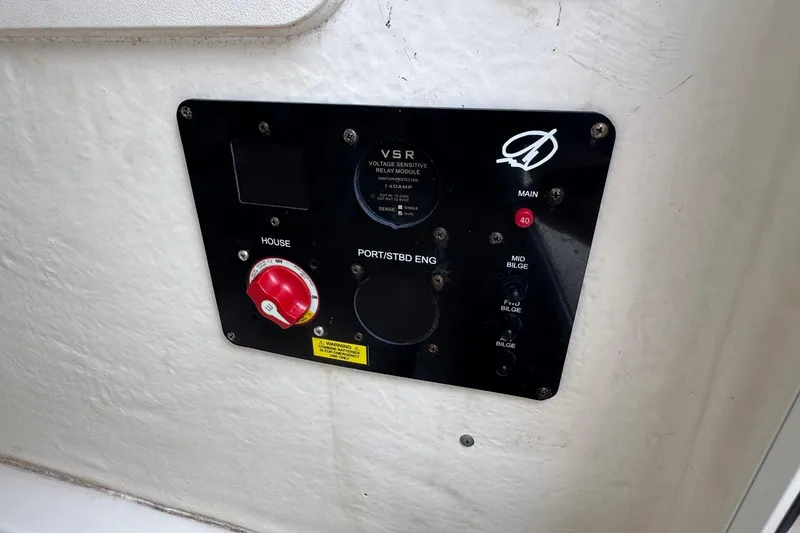 Slide: The Image of Control panel on 2023 Sailfish 242 CC boat, featuring switches and indicators. - 38