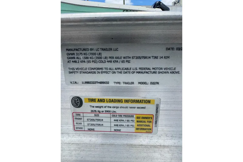 Slide: The Image of 2023 Sailfish 242 CC trailer label with tire and loading information. - 46