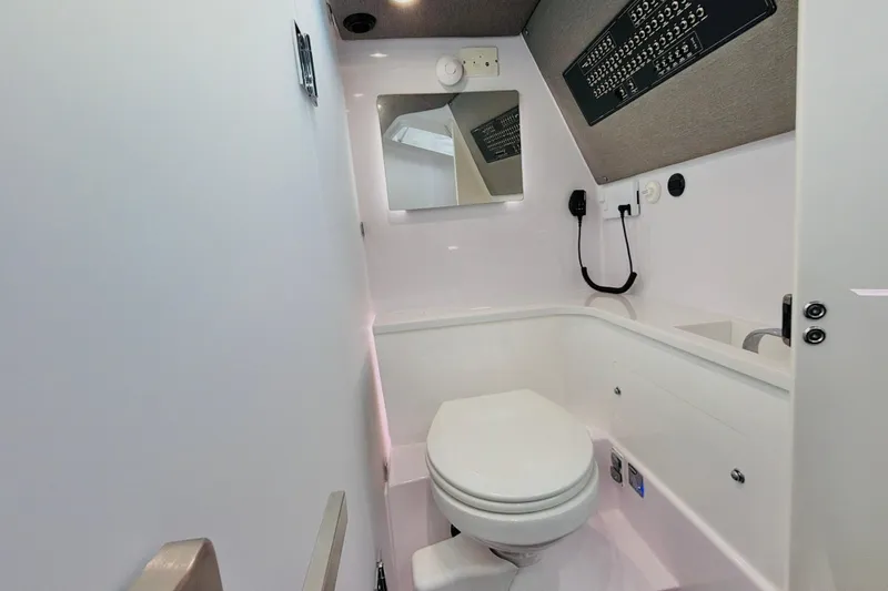 Slide: The Image of 2020 Axopar 37 XC Cross Cabin bathroom with modern fixtures and sleek design. - 36