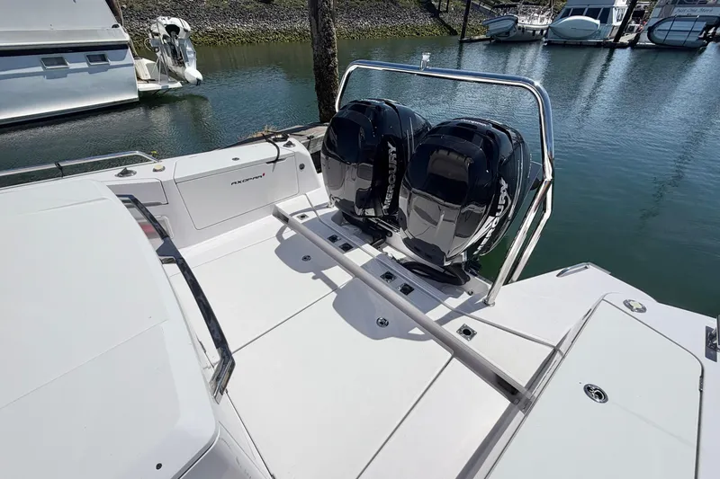Slide: The Image of 2020 Axopar 37 XC Cross Cabin with dual Mercury outboard engines docked at marina. - 10