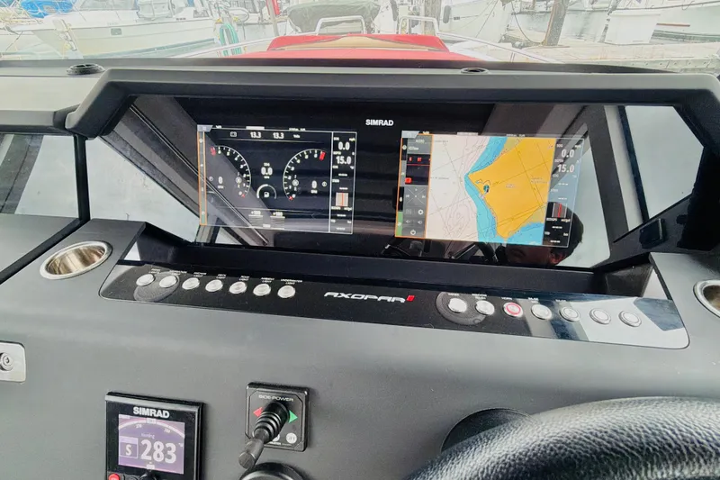 Slide: The Image of Dashboard of 2020 Axopar 37 XC Cross Cabin with Simrad navigation displays. - 29