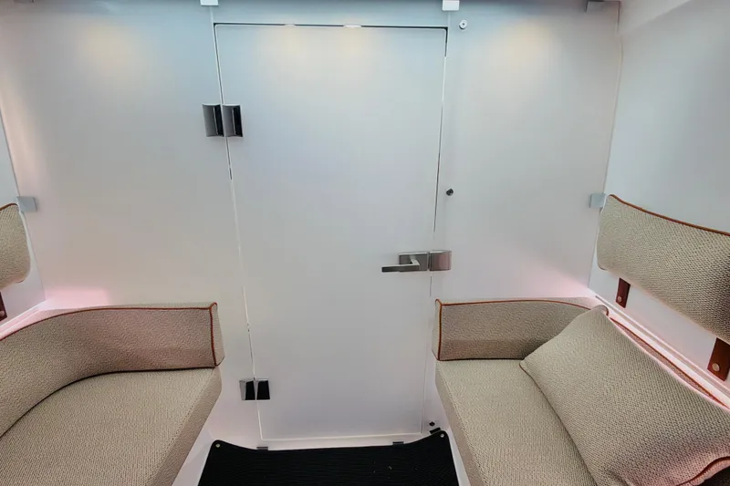 Slide: The Image of Interior of 2020 Axopar 37 XC Cross Cabin with beige seating and modern design. - 32