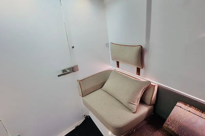 Slide: The Image of Interior of 2020 Axopar 37 XC Cross Cabin with cushioned seating and modern design. - 35