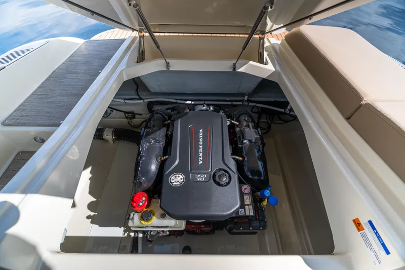 Slide: The Image of Engine compartment of 2025 Chris-Craft Sportster 25, featuring a Volvo Penta engine. - 16