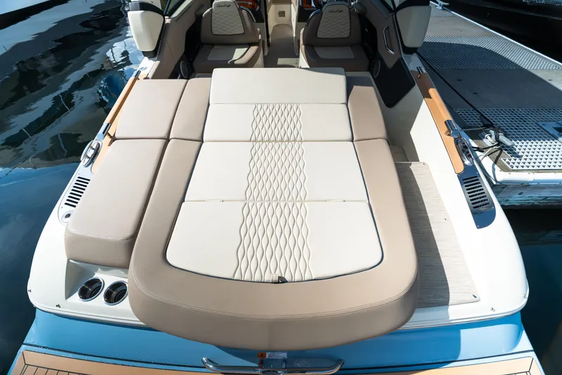 Slide: The Image of 2025 Chris-Craft Sportster 25 boat with luxurious sunbed and elegant interior design. - 5
