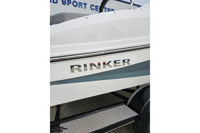 Slide: The Image of 2020 Rinker 19QX BR boat side view with logo and trailer. - 13
