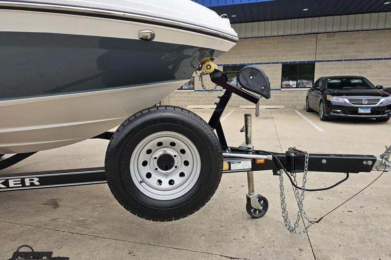 Slide: The Image of 2020 Rinker 19QX BR boat on trailer in parking lot. - 20