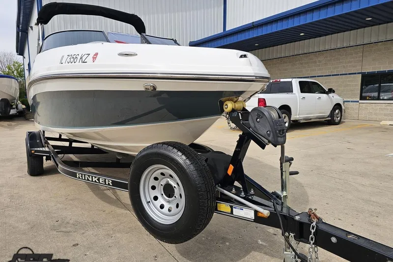 Slide: The Image of 2020 Rinker 19QX BR boat on trailer in parking lot. - 21