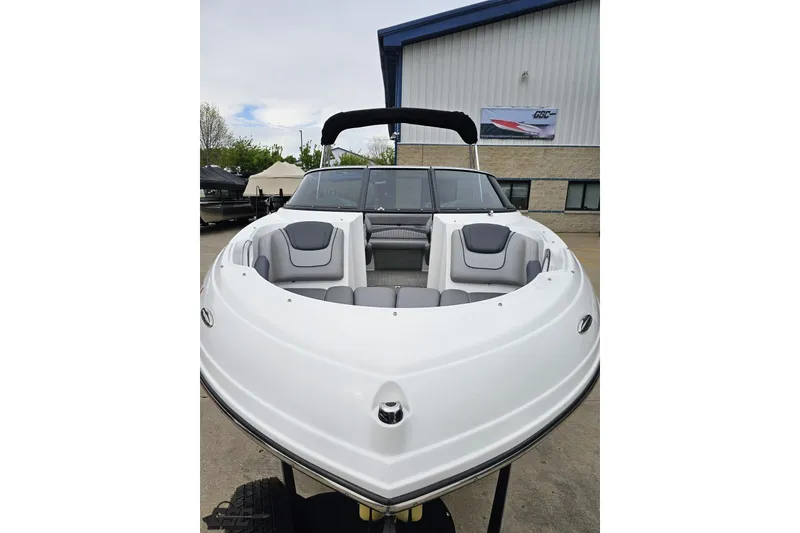 Slide: The Image of 2020 Rinker 19QX BR boat with sleek white design and spacious seating. - 23