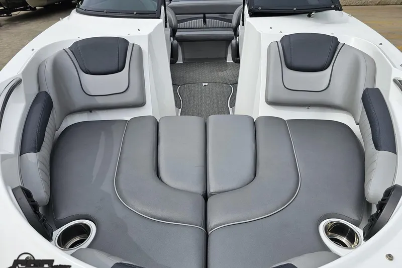 Slide: The Image of 2020 Rinker 19QX BR boat interior with gray seating and cup holders. - 25